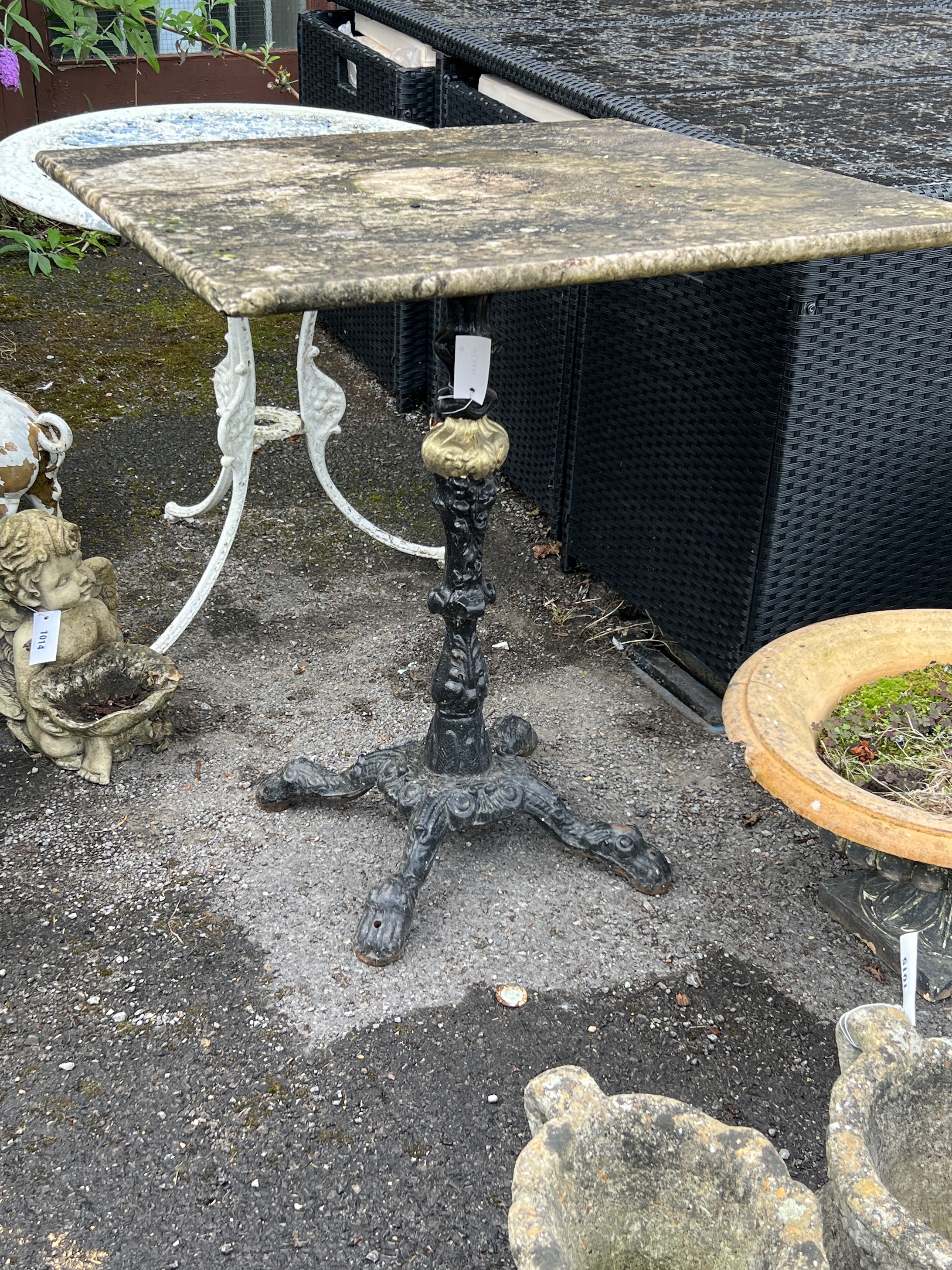 A Victorian style square marble topped cast iron garden table, width 69cm, height 73cm together with a circular aluminium garden table